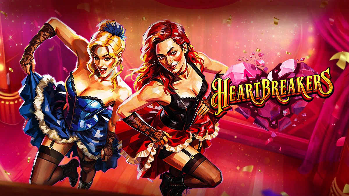 Heartbreakers – atmospheric cabaret stage with red velvet curtains, glowing footlights, ornate golden arches and shimmering pink crystal heart logo against a deep purple backdrop